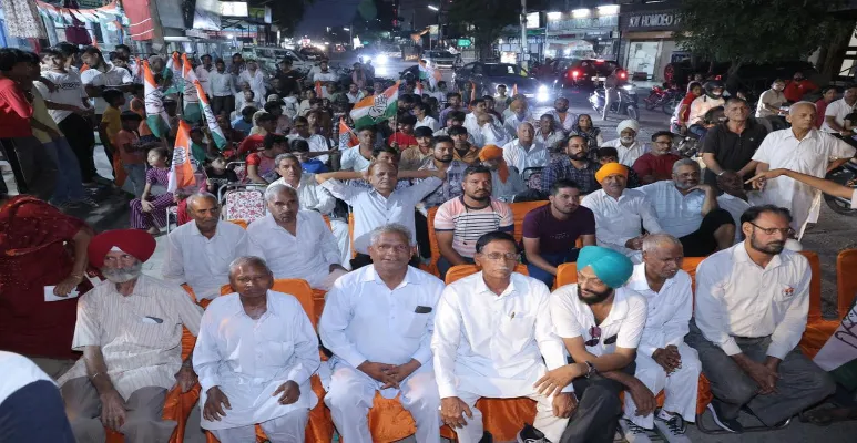 Supporters listen to Nirmal Singh Speech