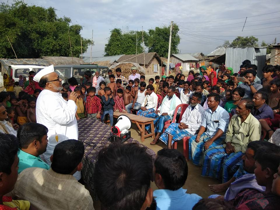Abidur Rahman addressing and engaging with villagers during a public meeting.