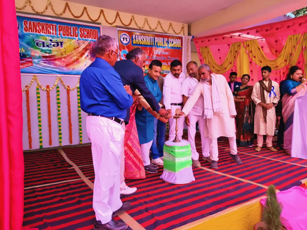 Jitendra Kumar lighting the lamp at Sanskriti Public School event.