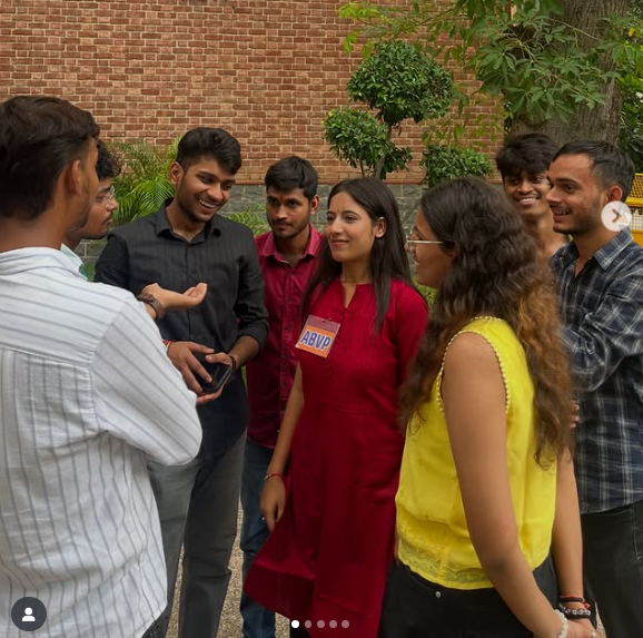Deepika Jha talking with students.